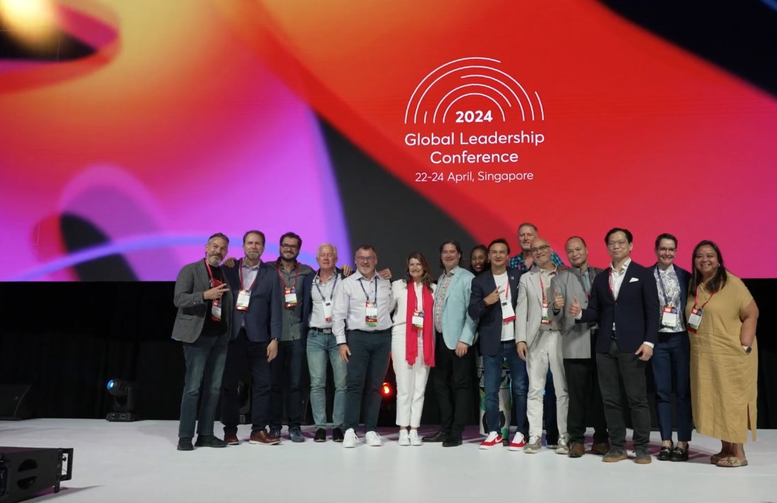 GLC 2024 attendees on stage in Singapore during the conference's closing moments