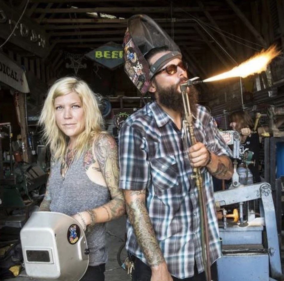 Darcy Hanna and Jay Gordon of Blackout Signs in their shop