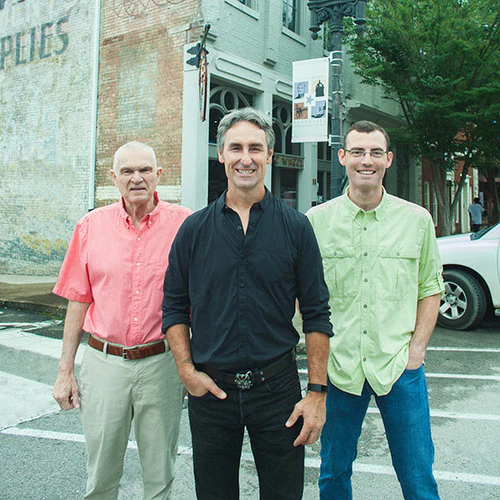 Mike Wolfe with two other men on a Main Street in Columbia, Tennessee
