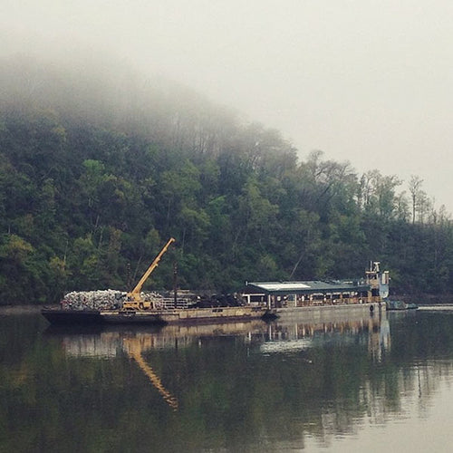 A barge on the fog-covered Mississippi River